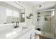 Updated bathroom featuring a shower with decorative tile, new vanity and modern fixtures at 2026 S Emerson --, Mesa, AZ 85210