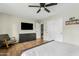 Bright bedroom featuring wood floors, a ceiling fan, closet, dresser and a rocking chair at 2026 S Emerson --, Mesa, AZ 85210