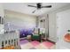 Charming Bedroom with a crib, accent wall, colorful decor, and playful atmosphere at 2026 S Emerson --, Mesa, AZ 85210