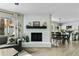 Open-concept living area with a fireplace, seamlessly connected to the dining and kitchen spaces at 2026 S Emerson --, Mesa, AZ 85210