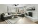 Inviting living room featuring a large sectional sofa, fireplace, and bright ambiance at 2026 S Emerson --, Mesa, AZ 85210
