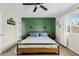 The main bedroom features a green accent wall, ceiling fan, and neutral color palette at 2026 S Emerson --, Mesa, AZ 85210
