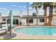 Backyard pool with lush palm trees and patio furniture, perfect for relaxing and entertaining guests at 2026 S Emerson --, Mesa, AZ 85210