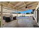 Beautiful backyard boasts a covered patio, lounge seating, and a sparkling pool for outdoor enjoyment at 2218 W Curry St, Chandler, AZ 85224