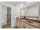 Bathroom features dual sinks, matching mirrors, and a glass-enclosed shower at 2218 W Curry St, Chandler, AZ 85224