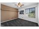 Bedroom features a ceiling fan, neutral carpeting, and a window that provides great natural light at 2218 W Curry St, Chandler, AZ 85224