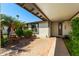 Inviting front entrance with a covered walkway, lush landscaping, and a stylish front door at 2218 W Curry St, Chandler, AZ 85224