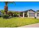 Charming single-Gathering home with well-manicured lawn, mature landscaping, and a two-car garage at 2218 W Curry St, Chandler, AZ 85224