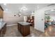 Open kitchen view shows a spacious granite island, tile floors, and access to the living room at 2218 W Curry St, Chandler, AZ 85224