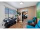 Stylish living area with a modern console table, large window, and comfortable seating arrangement at 2218 W Curry St, Chandler, AZ 85224