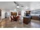 Open floorplan featuring a dining table with four chairs as well as the kitchen with island at 2218 W Curry St, Chandler, AZ 85224