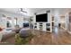 Open-concept living room with a cozy seating area, sliding glass doors, and a view of the backyard at 2218 W Curry St, Chandler, AZ 85224