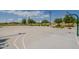Community basketball court with multiple hoops, landscaping, and desert vegetation at 23060 E Sonoqui Blvd, Queen Creek, AZ 85142