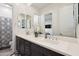 Bathroom featuring dual sinks, a large mirror, and modern fixtures at 23060 E Sonoqui Blvd, Queen Creek, AZ 85142