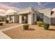 Stunning single-story home showcasing a well-maintained yard with low-water landscaping, perfect for curb appeal and minimal maintenance at 23060 E Sonoqui Blvd, Queen Creek, AZ 85142