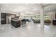 Expansive open-concept kitchen and living area with ample natural light and neutral decor, perfect for modern living and entertaining at 23060 E Sonoqui Blvd, Queen Creek, AZ 85142