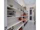Well-organized pantry with ample shelving for storage, ensuring a tidy and efficient kitchen space at 23060 E Sonoqui Blvd, Queen Creek, AZ 85142