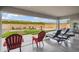 Spacious covered patio with lounge seating and view of backyard entertainment area at 23060 E Sonoqui Blvd, Queen Creek, AZ 85142