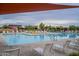 Community pool and lounge area offer a relaxing space, complete with plenty of seating and shade structures at 23060 E Sonoqui Blvd, Queen Creek, AZ 85142