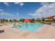 Community pool with colorful seating, splash pad, and shade features for residents at 23060 E Sonoqui Blvd, Queen Creek, AZ 85142