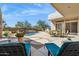 Backyard with a pool and patio area. The pool has a rock waterfall feature at 23520 N 80Th Way, Scottsdale, AZ 85255