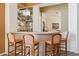 Elegant bar area with seating, mirrored backdrop, and stylish decor at 23520 N 80Th Way, Scottsdale, AZ 85255