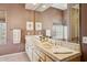Bathroom featuring a long vanity with double sinks, tiled countertops, and neutral walls at 23520 N 80Th Way, Scottsdale, AZ 85255
