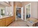 Bathroom has a vanity with a door into bedroom and walk-in closet at 23520 N 80Th Way, Scottsdale, AZ 85255