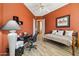 Bedroom featuring warm walls, desk area, day bed, and ceiling fan at 23520 N 80Th Way, Scottsdale, AZ 85255