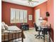 Bedroom featuring warm walls, desk area, day bed, and shuttered window at 23520 N 80Th Way, Scottsdale, AZ 85255