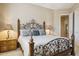 Bedroom with decorative metal bedframe, neutral walls, and access to other rooms at 23520 N 80Th Way, Scottsdale, AZ 85255