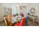 Bright dining room features a glass table with colorful chairs and decorative shelving at 23520 N 80Th Way, Scottsdale, AZ 85255