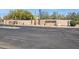 A welcoming entrance to the community with desert landscaping and a brick wall at 23520 N 80Th Way, Scottsdale, AZ 85255