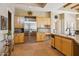 Bright, open kitchen with stainless steel refrigerator, island, and ample cabinet space at 23520 N 80Th Way, Scottsdale, AZ 85255