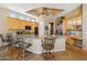Open kitchen with stainless appliances, granite countertops, bar seating, and a coffered ceiling at 23520 N 80Th Way, Scottsdale, AZ 85255