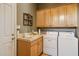 Laundry room with cabinets and a sink at 23520 N 80Th Way, Scottsdale, AZ 85255