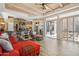 Open living area with access to patio; features comfortable seating and stylish decor at 23520 N 80Th Way, Scottsdale, AZ 85255