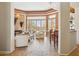 Open living room with fireplace, tile floors, and plentiful natural light at 23520 N 80Th Way, Scottsdale, AZ 85255
