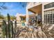 Inviting outdoor patio with ample seating and views of the refreshing pool and desert landscaping at 23520 N 80Th Way, Scottsdale, AZ 85255