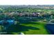 Beautiful aerial view showcasing the sprawling community with a golf course and community pool at 247 E Las Puertas Ln, Queen Creek, AZ 85140
