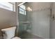 This bathroom features a glass shower and mosaic wall trim at 247 E Las Puertas Ln, Queen Creek, AZ 85140