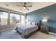 Bedroom with large windows, neutral carpet, and accent wall at 247 E Las Puertas Ln, Queen Creek, AZ 85140