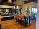 Inviting dining area featuring tastefully set tables, comfortable chairs, and a view of a decorated Christmas tree at 247 E Las Puertas Ln, Queen Creek, AZ 85140