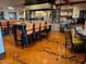 Expansive dining area featuring patterned floors, tastefully set tables, and comfortable seating arrangements at 247 E Las Puertas Ln, Queen Creek, AZ 85140