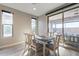 Bright dining room features a sliding glass door and modern wood-look floors at 247 E Las Puertas Ln, Queen Creek, AZ 85140