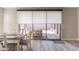 Cozy dining room with glass door to outdoor lounge area at 247 E Las Puertas Ln, Queen Creek, AZ 85140