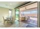 Bright dining room flows seamlessly to outdoor patio with lounge seating at 247 E Las Puertas Ln, Queen Creek, AZ 85140
