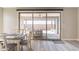 Relaxing dining room with sliding glass door to an outdoor covered patio at 247 E Las Puertas Ln, Queen Creek, AZ 85140