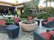 Cozy outdoor fire pit area with ample seating, ideal for entertaining guests in a relaxed setting at 247 E Las Puertas Ln, Queen Creek, AZ 85140