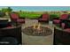 Scenic outdoor seating area with a fire pit, offering a tranquil spot to enjoy the beautiful landscape at 247 E Las Puertas Ln, Queen Creek, AZ 85140